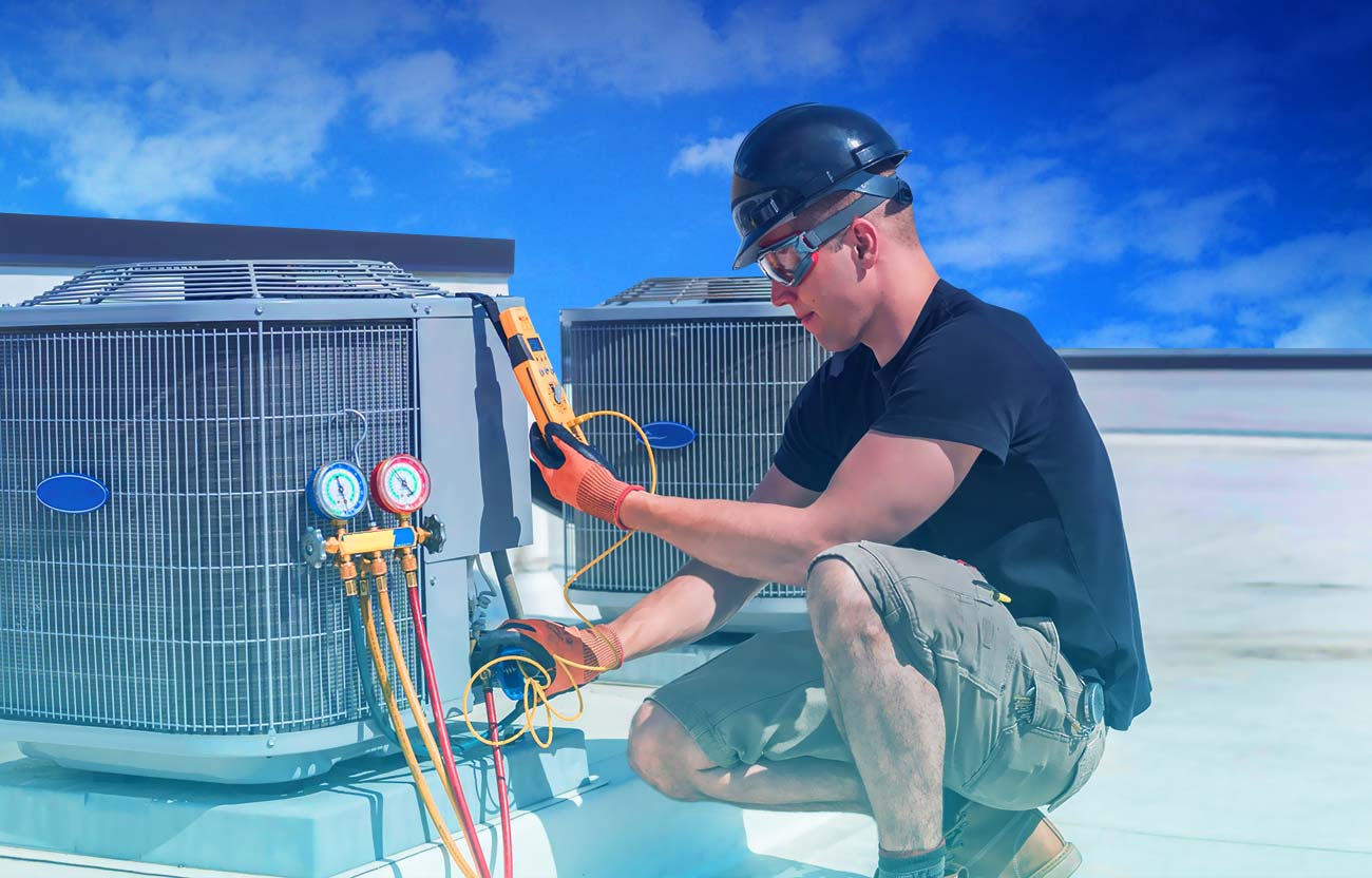 HVAC technician servicing an outdoor air conditioning unit